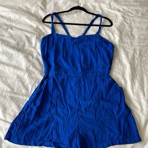 Gorgeous, electric blue romper shorts, with criss cross straps and two pockets